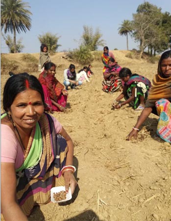 Members of one SHG learning about watermelon cultivation.