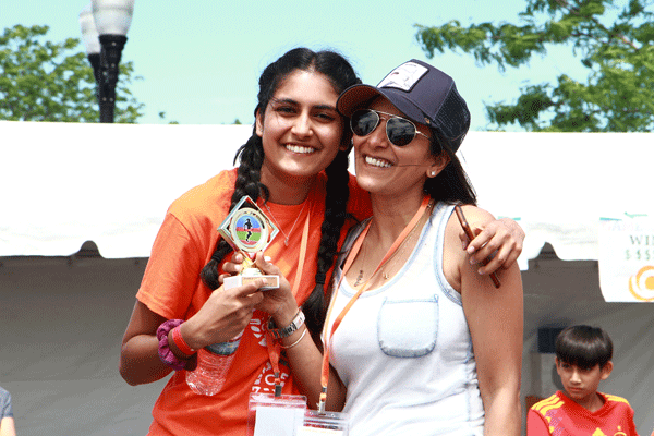 A pair of runners pose at the 5K finish line.