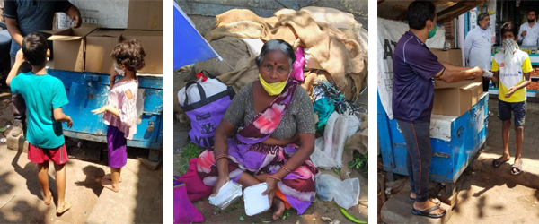 Beneficiaries receive khichdi meals.