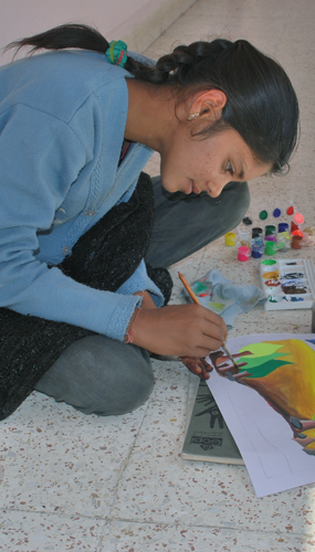 Young girl painting.